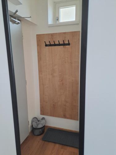 a door in a room with a mat on the floor at Apartmans MWM Brno 3 in Brno