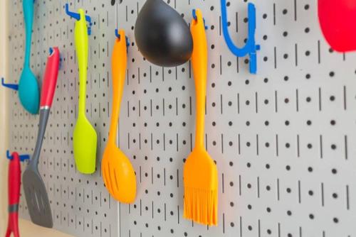 a wall with spoons and utensils hanging on it at Steps To Jmu & I-81 Fenced Yard Walk 2 Starbucks in Harrisonburg