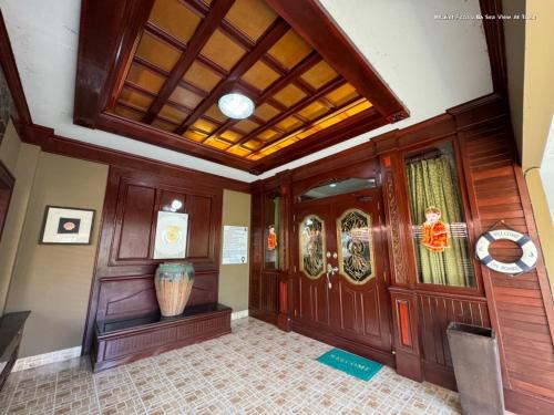 a hallway with wood paneling and a ceiling at Angel Pool Villa Phuket - SHA Extra Plus in Phuket Town