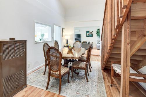 a dining room with a table and chairs at 2 Mi to Downtown Coos Bay Home with Deck, Fire Pits in Coos Bay