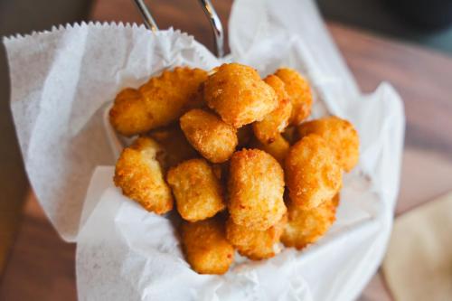 a pile of fried food sitting on top of a napkin at Vīb Best Western Springfield in Springfield