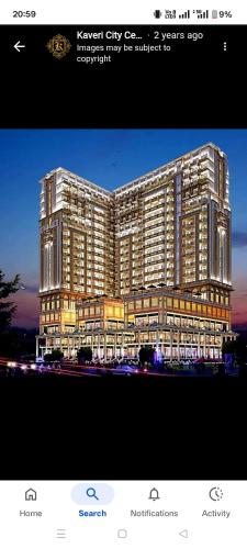 a rendering of a large building with lights on at Anmolairbnb in Greater Noida