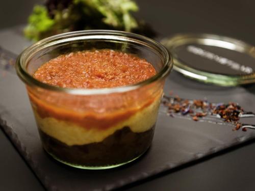 a jar of food sitting on a table at Novotel Genève Centre in Geneva