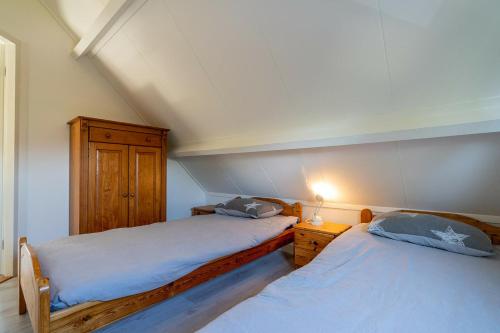 Postel nebo postele na pokoji v ubytování Zuiderdiep 06 - Noordzeepark Ouddorp NOT INTENDED FOR COMPANY OR WORK-RELATED STAYS