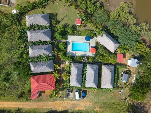 an aerial view of a house with a swimming pool at Banana Tree Popoyo in Popoyo