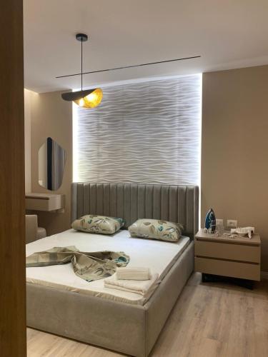 a bedroom with a bed with a large window at Casa Luxe in Kashari