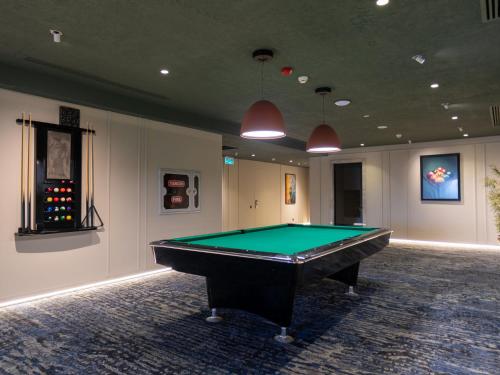 a room with a pool table in it at Shirvan Grand Hotel Shamakhi in Şamaxı