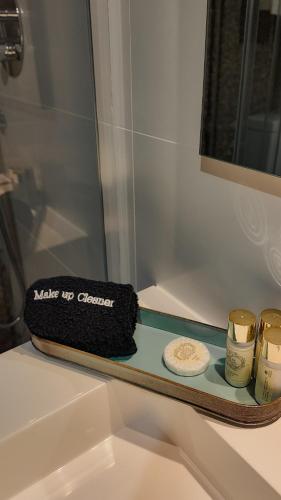 a bathroom shelf with two candles and a mirror at Quinta de São Francisco Houses in Viseu