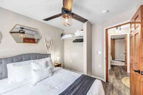 a bedroom with a large bed and a mirror at Across The Street From Von Stiehl-newly Renovated! in Algoma