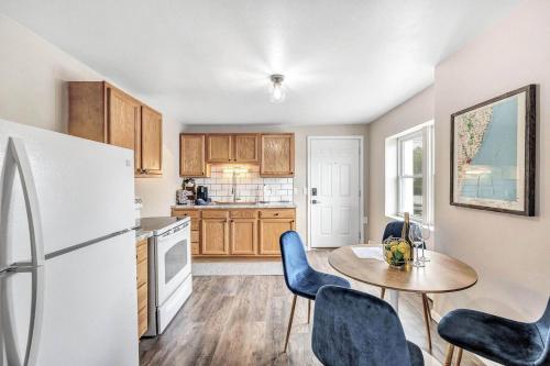 a kitchen with a table and chairs and a refrigerator at Across The Street From Von Stiehl-newly Renovated! in Algoma
