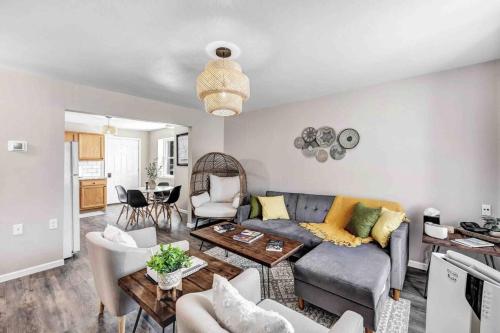 a living room with a couch and a table at Across The Street From Von Stiehl-newly Renovated! in Algoma