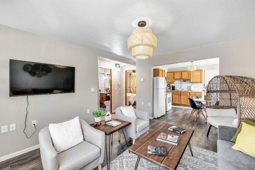 a living room with a couch and a table at Across The Street From Von Stiehl-newly Renovated! in Algoma