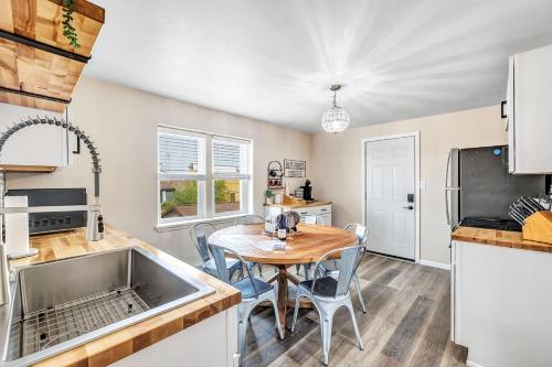 a kitchen and dining room with a table and chairs at Across The Street From Von Stiehl-newly Renovated! in Algoma