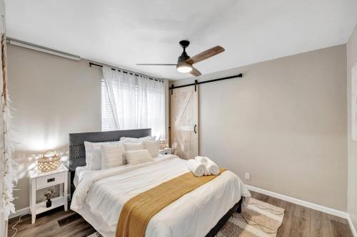 a bedroom with a bed and a ceiling fan at Across The Street From Von Stiehl-newly Renovated! in Algoma