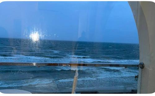 a view of the ocean from a window at Moon Kê gà hotel in Phan Thiet