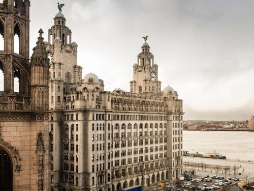 a building with a clock tower on top of it at ibis Liverpool Centre Albert Dock – Liverpool One in Liverpool