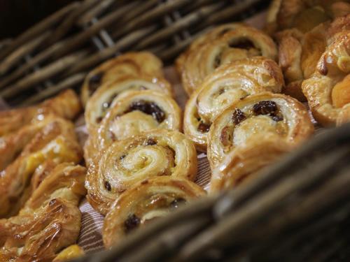 a bunch of pastries sitting in a basket at ibis Liverpool Centre Albert Dock – Liverpool One in Liverpool