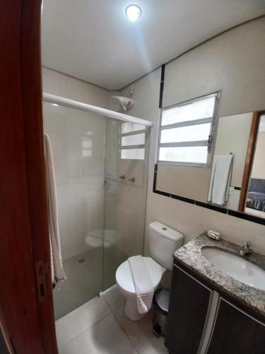 a bathroom with a shower and a toilet and a sink at Flat - Apartium Palacete Victória in Sao Paulo