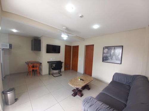 a living room with a couch and a table at Flat - Apartium Palacete Victória in Sao Paulo