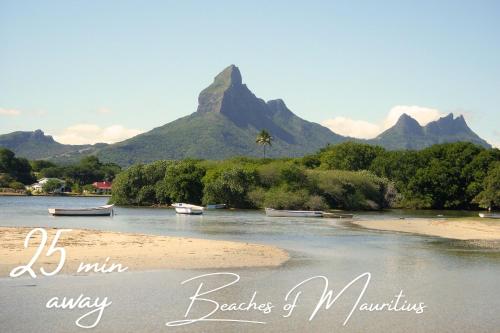 a picture of a river with mountains in the background at Lovely home in Ebene with beautiful views in Ebene