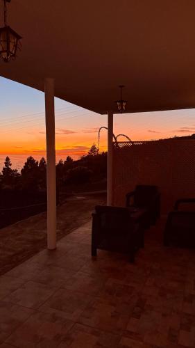 a view of a sunset from a patio at Casa Tajinaste in Tijarafe