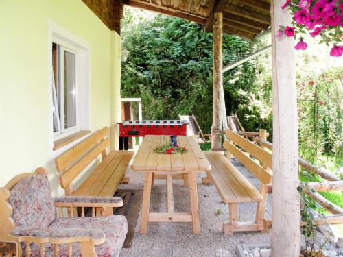 a ping pong table on the porch of a house at Apartment Benjamin by Interhome in Hollersbach im Pinzgau