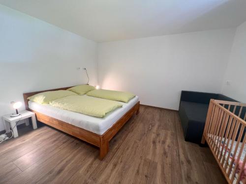 a bedroom with a large bed and a staircase at Apartment Benjamin by Interhome in Hollersbach im Pinzgau