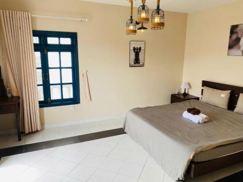 Postel nebo postele na pokoji v ubytování Nu Homestay Đà Lạt