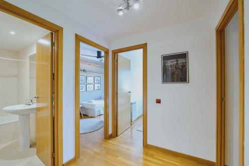 a bathroom with a sink and a toilet and a mirror at 3 bedroom Huge apartament near the beach in Sant Adria de Besos