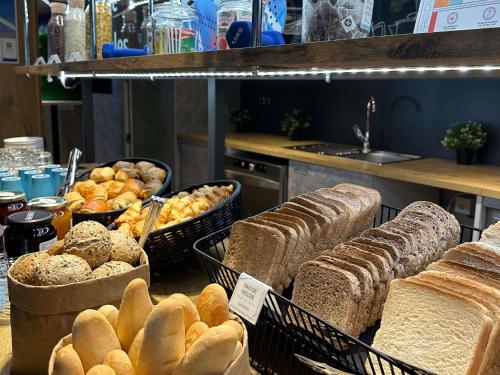 a bunch of different types of bread in baskets at Ibis Budget Madrid Alcorcón Móstoles in Alcorcón