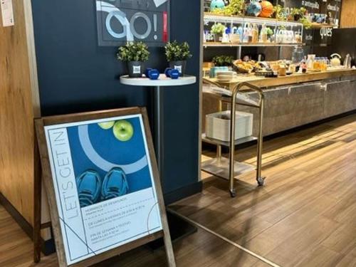 a store with a sign in the middle of a store at Ibis Budget Madrid Alcorcón Móstoles in Alcorcón