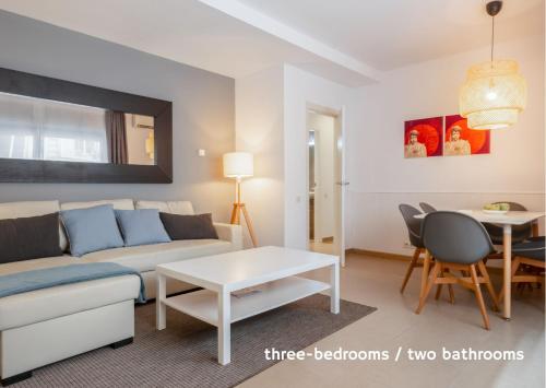 a living room with a couch and a table at Inside Barcelona Apartments Salva in Barcelona