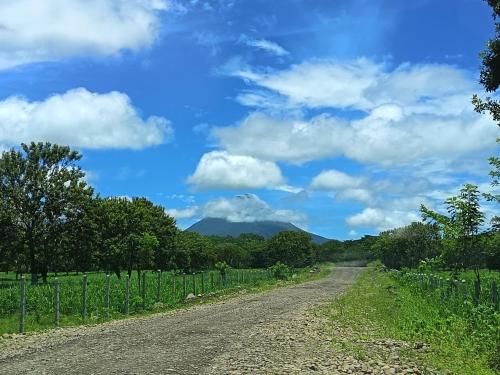 a dirt road with a mountain in the distance at Apartment-Pura Vida-wi-fi-6 people, AC- parking-river-garden in Fortuna
