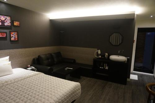 Postel nebo postele na pokoji v ubytování MU Hotel