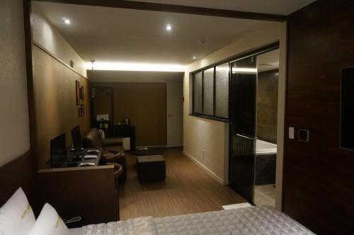 Postel nebo postele na pokoji v ubytování MU Hotel