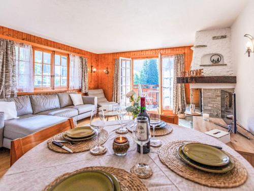 a living room with a table with plates on it at Apartment Vermont 8 by Interhome in Villars-sur-Ollon