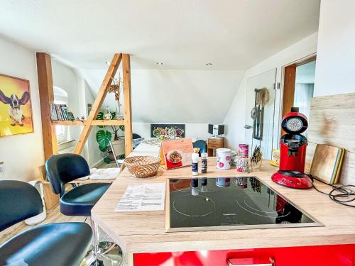 a room with a table and chairs in a room at Apartment Ferienwohnung Naturblick Karla Rößler by Interhome in Grüna
