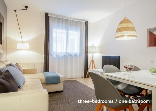 a living room with a couch and a table at Inside Barcelona Apartments Salva in Barcelona