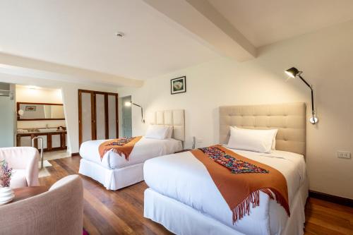 Ένα ή περισσότερα κρεβάτια σε δωμάτιο στο Casa Eva Hotel Boutique