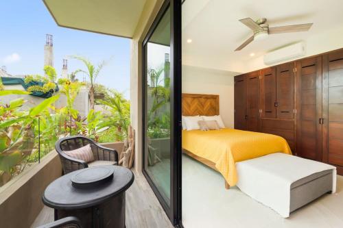 a bedroom with a bed and a balcony at Casa Armada Beachfront Condo with Pool in San Francisco