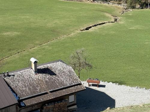 an overhead view of a roof of a house and a bench at Chalet Schipplbadstube by Interhome in Annaberg im Lammertal
