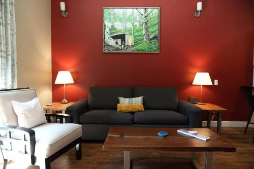 a living room with a couch and a table at The Inlet Haven - 2 Bedroom on the Inlet in Ucluelet