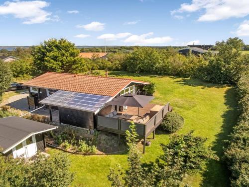 an aerial view of a house with solar panels on the roof at Holiday Home Berner - 500m to the fjord by Interhome in Flovtrup