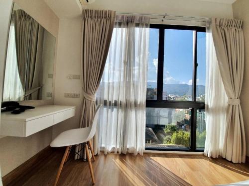 Voodi või voodid majutusasutuse Nimman Center Mountain View With Rooftop Pool toas