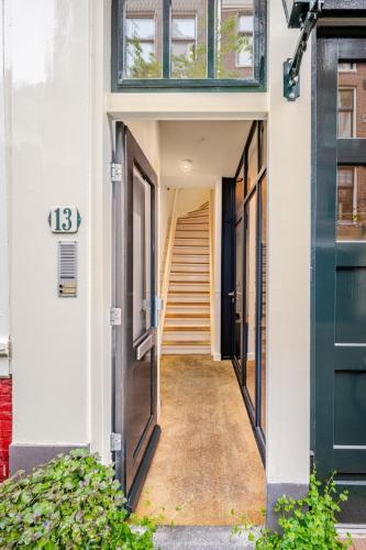 a hallway of a building with a stairway at Huis Roomolen in Amsterdam