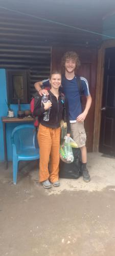 a boy and a girl posing for a picture at coraizone hostel in Cobán