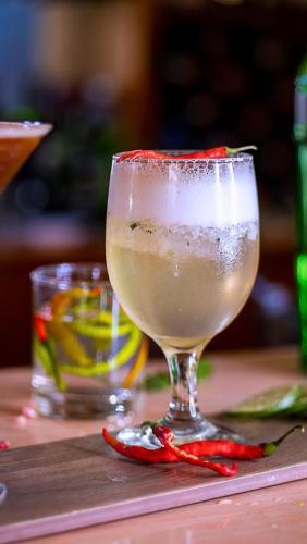 a drink in a glass sitting on a table at Lake Bogoria Spa Resort in Marigat