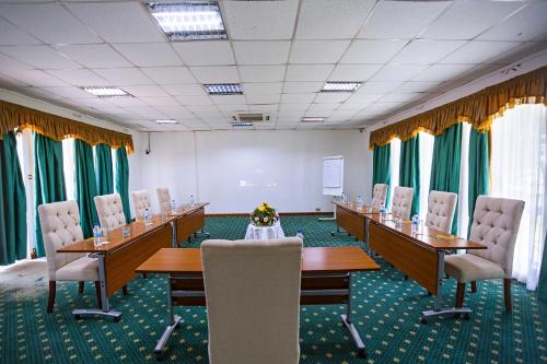 a conference room with long tables and chairs in it at Lake Bogoria Spa Resort in Marigat