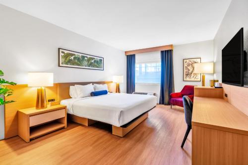 a hotel room with a bed and a tv at CasaBlanca Resort, Casino, Golf & Spa in Mesquite