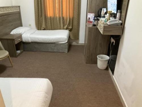 Ένα ή περισσότερα κρεβάτια σε δωμάτιο στο المشاعر